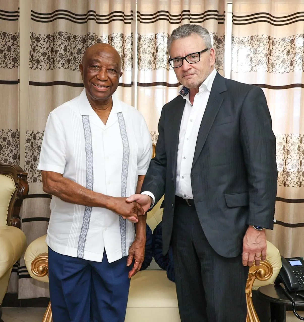 A GCG Global Forum handshake at an official meeting